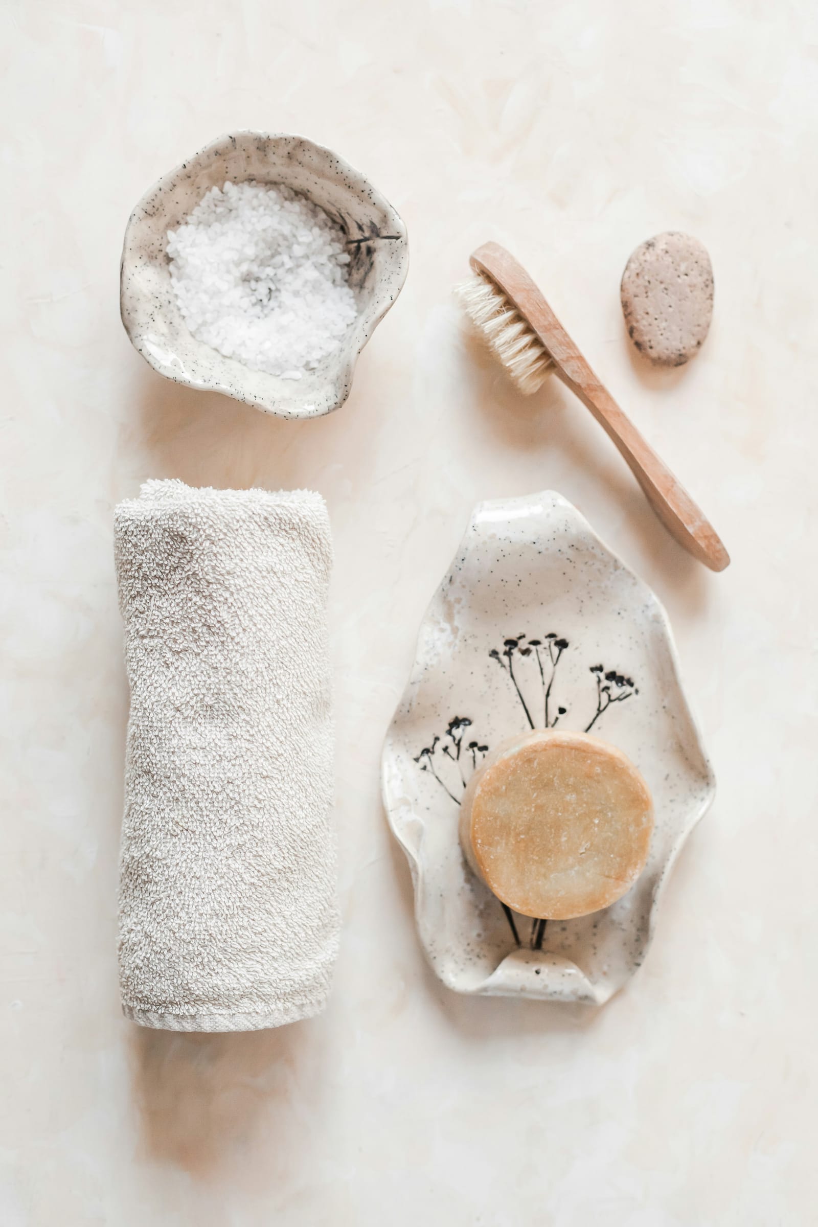 Spa ritual objects — towel, salts, brush